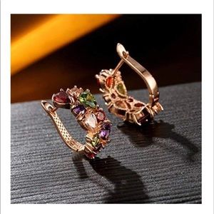 Gold earrings with multi color gems
